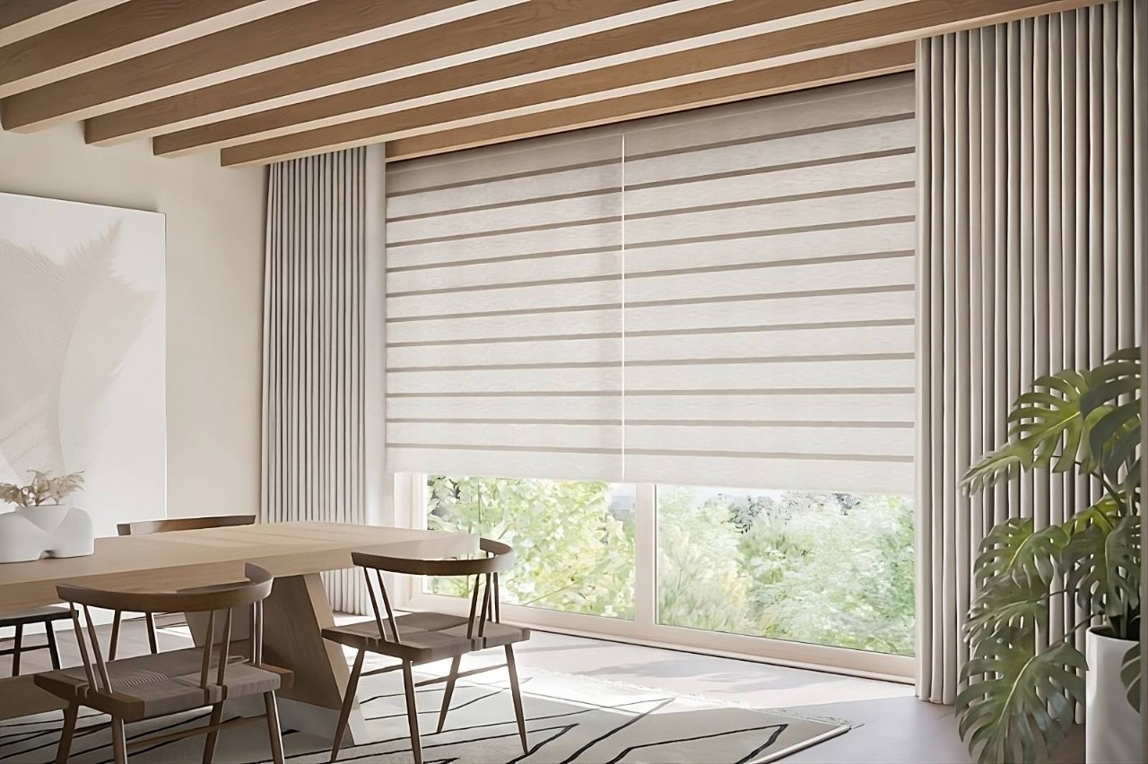 Neutral-colored Hunter Douglas Vignette® Roman Shades on large windows in a modern dining room at Window Accents & Flooring near Princeton, NJ
