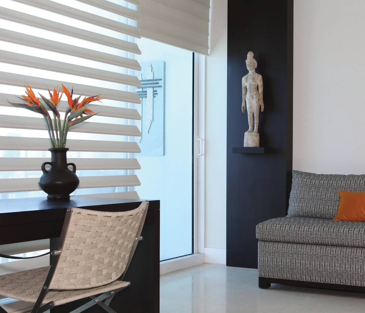 Home front door with nearby windows decorated with Hunter Douglas Pirouette® Sheer Shades at Window Accents & Flooring near Princeton, NJ