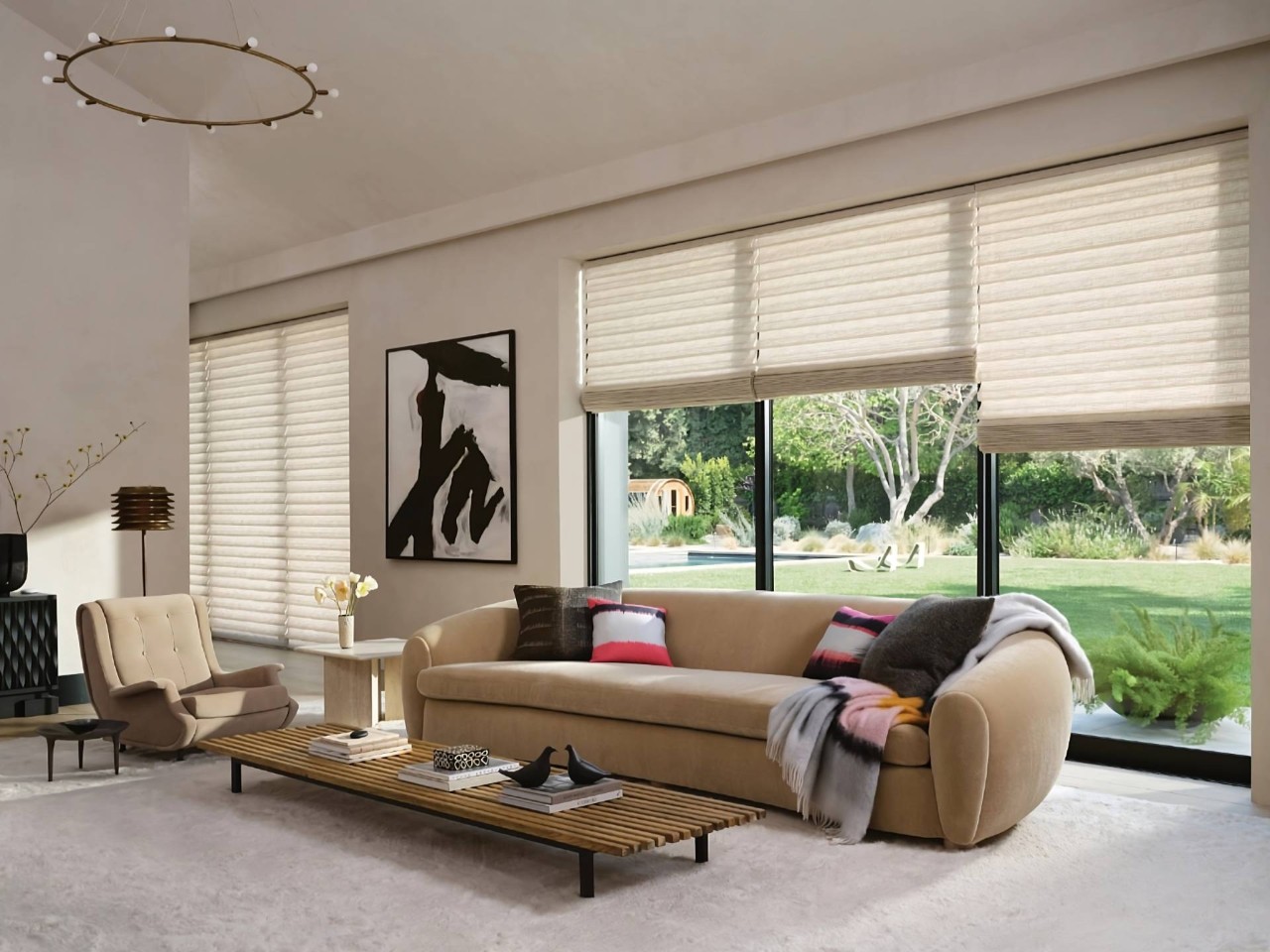 Vignette® Roman Shades on large windows in a cozy living room at Window Accents & Flooring near Princeton, NJ