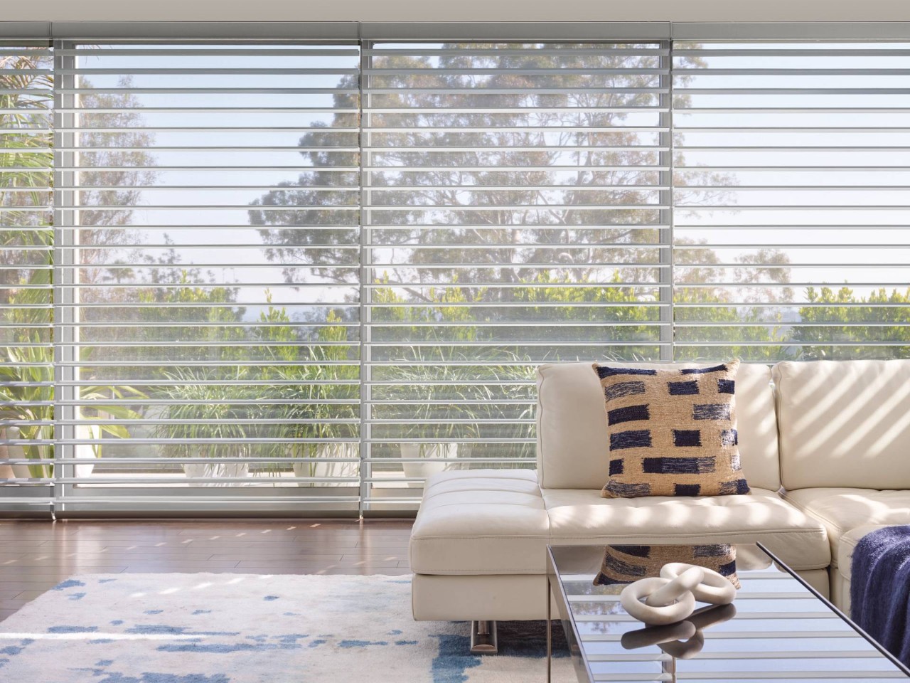 Hunter Douglas Silhouette® Sheer Shades on wide windows in a bright and airy living room at Window Accents & Flooring near Princeton, New Jersey